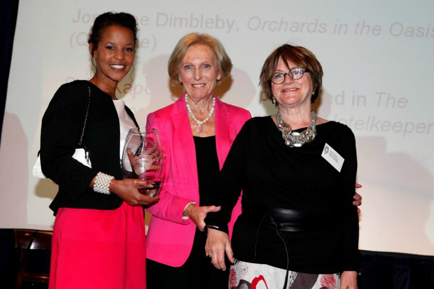 Deiniol Buxton (left) and Sheila Dillon (right) accepting the Derek Cooper Award for Campaigning and Investigative Food Writing or Broadcasting from Mary Berry